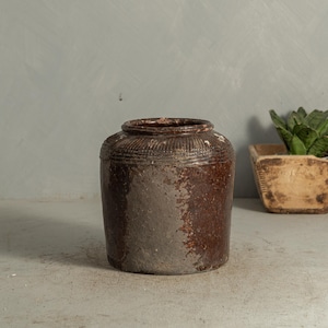 May include: A set of three ceramic mugs with a speckled, matte finish. The mugs are in shades of cream, light gray, and dark gray. Each mug has a simple, minimalist design, perfect for coffee or tea.