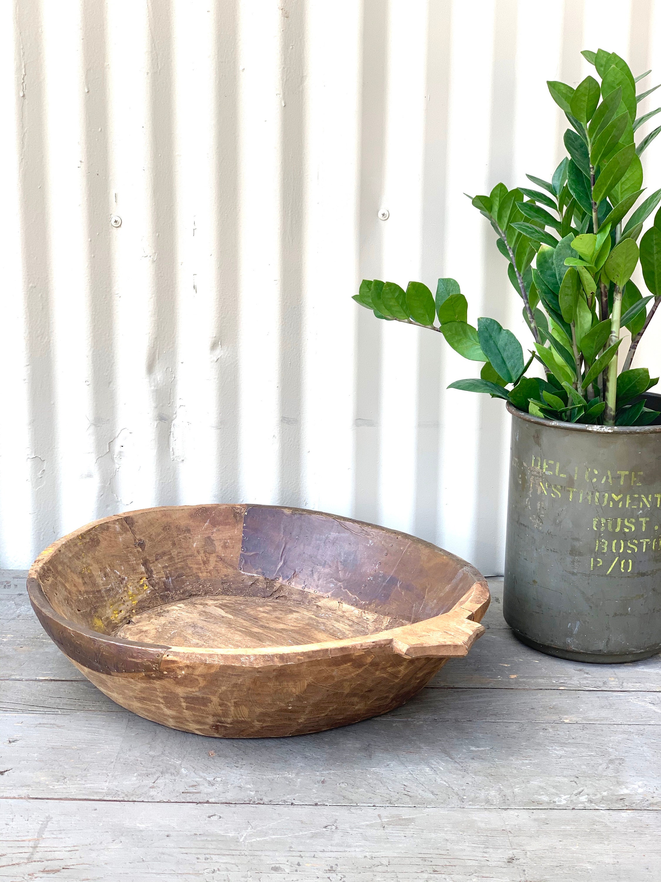 Rustic Wooden Bowl with Metal Patching