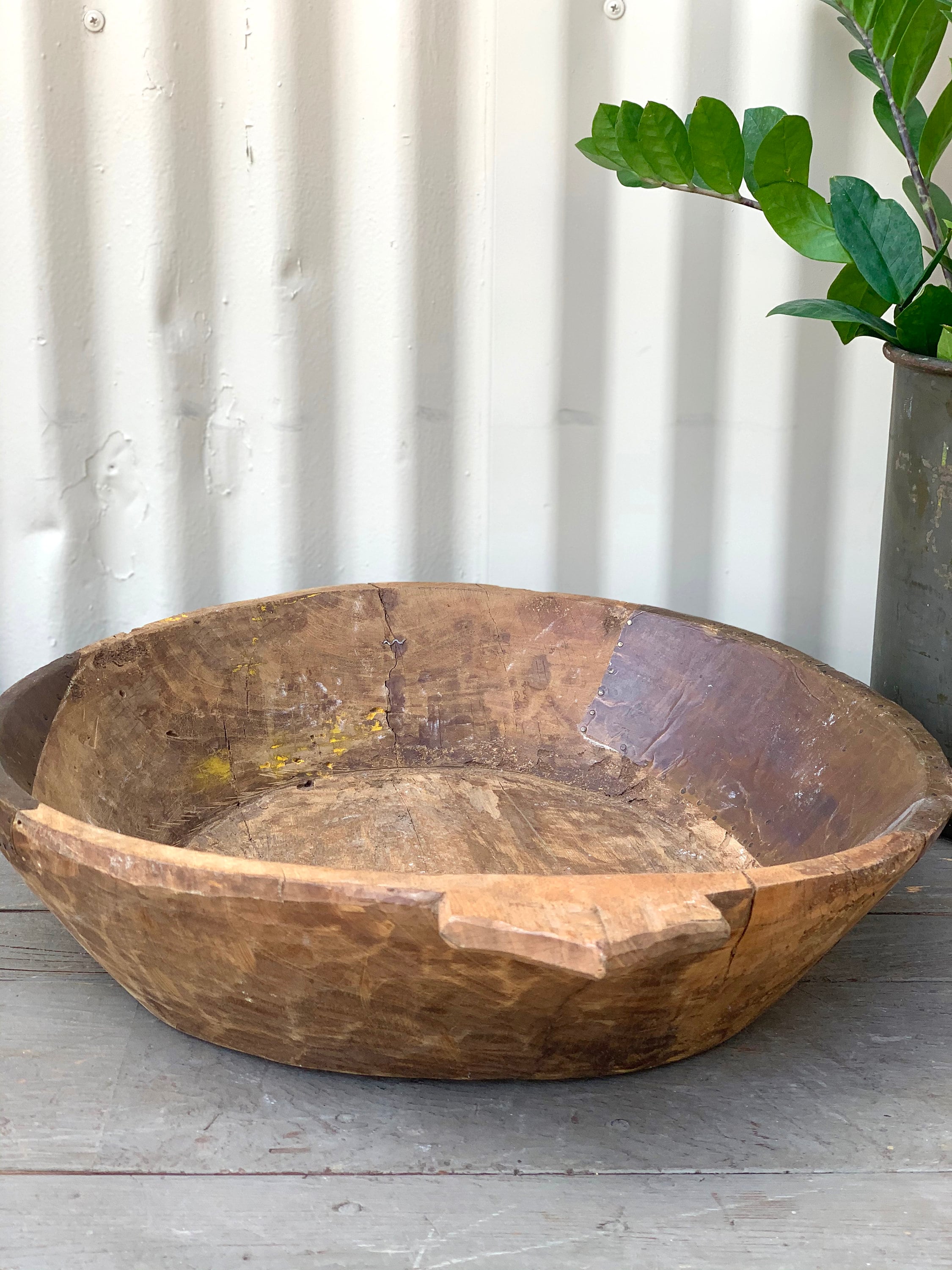 Rustic Wooden Bowl with Metal Patching