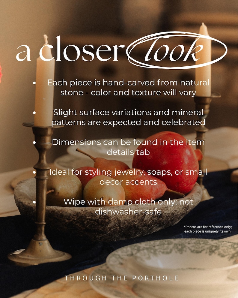 May include: A still-life image featuring a stone bowl filled with pears and a pomegranate, flanked by two lit candles in brass candlesticks. The text "a closer look" is at the top. The image suggests home decor.