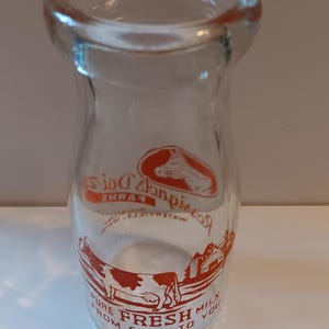 Milk Bottle.Vintage.Half Pint.Rossignols.Waterville, Maine.Red Pyro.