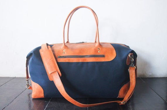 Waxed canvas and leather weekend and travel bag for men and women. Handmade carry on duffel and travel bag. Anniversary gift in navy blue