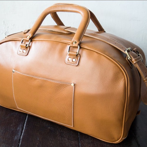 Weekend leather travel bag for men and women. Duffle, messenger and carry on bag for extended weekend travel. Handmade holdall in brown