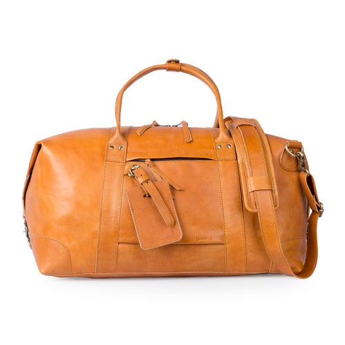 Leather duffle and travel bag handmade in leather. Weekend holdall as gift for anniversary for men and women. Personalize for anniversary