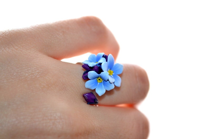 Delicate blue forget me not flowers on a sterling silver ring base Minimal design