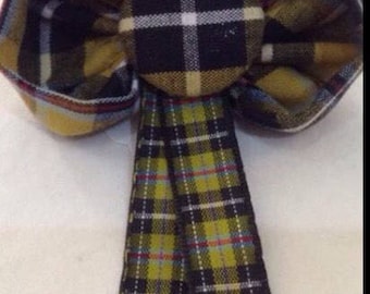 Cornish Tartan Fabric buttonhole with St Piran Flag button centre.