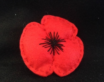 Poppy brooch with embroidered centre. Approximate diameter 2.5inch.