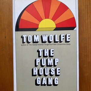 May include: A book cover for "The Pump House Gang" by Tom Wolfe. The design includes a retro sunburst in shades of orange and red. The author's name is at the top, with the title in bold, white letters with a black outline.