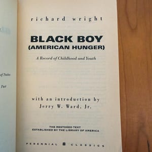 May include: The title page of the book Black Boy (American Hunger) by Richard Wright, featuring the subtitle A Record of Childhood and Youth, an introduction by Jerry W. Ward, Jr., and the text The Restored Text Established by the Library of America.