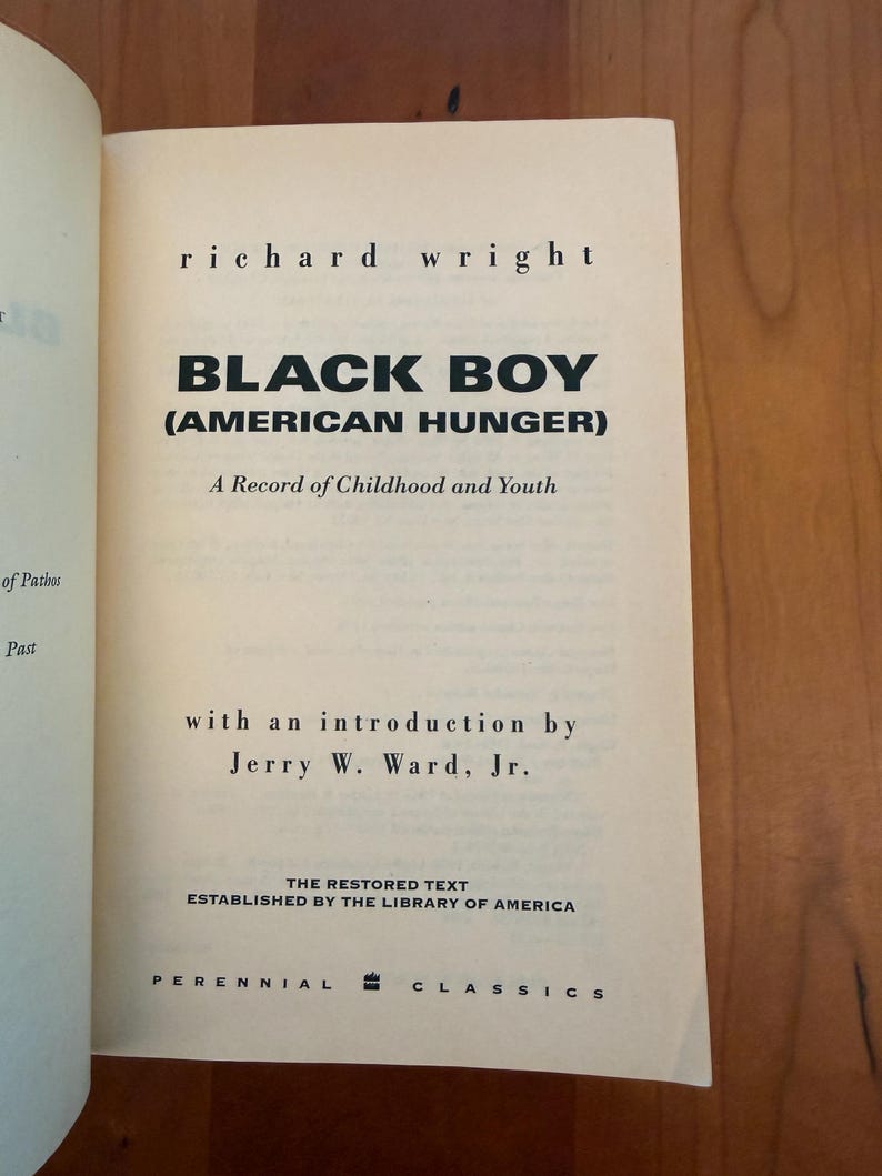 May include: The title page of the book Black Boy (American Hunger) by Richard Wright, featuring the subtitle A Record of Childhood and Youth, an introduction by Jerry W. Ward, Jr., and the text The Restored Text Established by the Library of America.