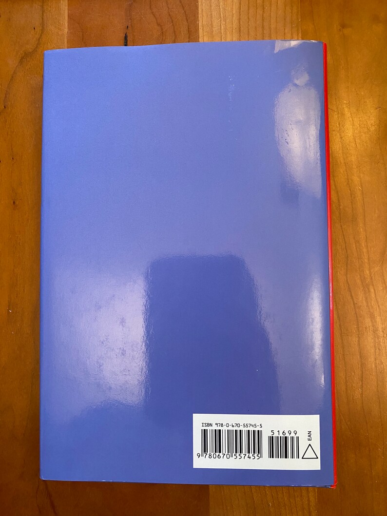 May include: The back cover of a blue hardcover book with a barcode and ISBN number: 978-0-470-55745-5. The book has a red spine with the word "EAN" printed on it.