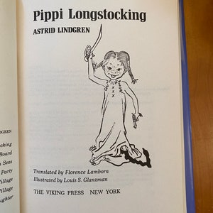 May include: Black and white illustration of Pippi Longstocking, a fictional character from the children's book series by Astrid Lindgren. Pippi is standing with her arms raised, holding a sword in one hand and a gun in the other. The book cover also includes the title "Pippi Longstocking" and the author's name, "Astrid Lindgren".