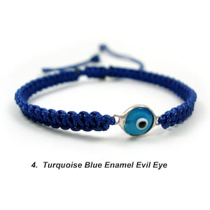 May include: Blue and turquoise evil eye charm bracelet with a dark blue braided cord.