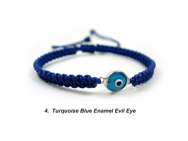 May include: Blue and turquoise evil eye charm bracelet with a dark blue braided cord.