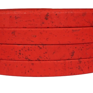 May include: Red cork fabric with a textured surface. The fabric is layered in four rows.