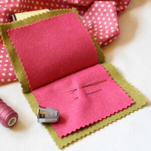 Bright pink inside 'leaves' of handmade green felt sewing needle book