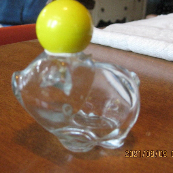 AVON clear glass pig vintage after shave or perfume decanter (empty); little pot bellied pig with yellow ball cap and white flower ribbon