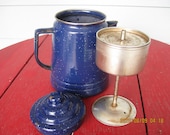 Blue speckled Enamel ware coffee pot with stem and basket to perk coffee. Old antique farmhouse kettle for the stovetop or over a campfire