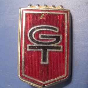 Vintage Ford Ford Emblem: Schwarzes Logo auf rotem Chevron, Metallplakette