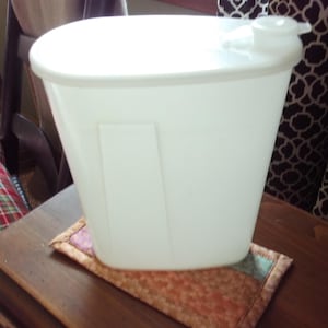 May include: A set of three ceramic mugs with a speckled, matte finish. The mugs are in shades of cream, light gray, and dark gray. Each mug has a simple, minimalist design, perfect for coffee or tea.