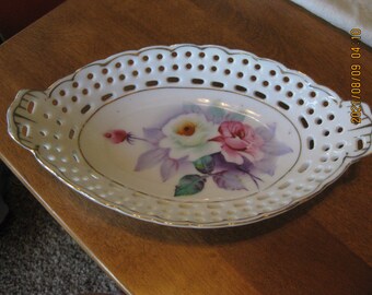 Oval floral open lace edge dish; hand painted roses; gold trim rim edges; 8 1/2" long; 4 1/2" wide; ceramic porcelain vanity, serving plate