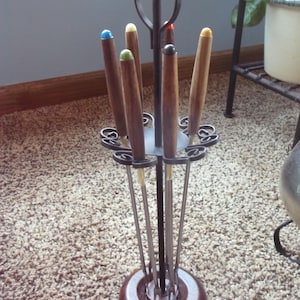 Vintage Fondue Forks and stand: 6 skewers on black metal stand; colored coded ends; teak wood handle. Cook at the table self-service dining