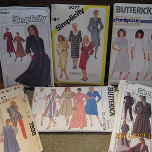 May include: A collection of vintage sewing patterns for women's clothing. The patterns are from Simplicity, McCall's, and Butterick. The patterns feature a variety of styles, including dresses, skirts, and tops. The patterns are in various colors, including red, blue, green, and black.