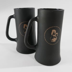 Vintage Pair of Matte Black Glass Playboy Club Mug with Gold Femlin Icon