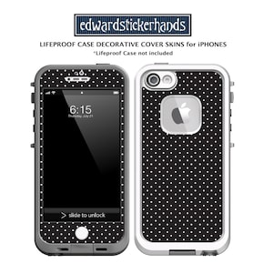 May include: A black and white polka dot phone case for an iPhone. The case is designed to fit a Lifeproof case, but the Lifeproof case is not included. The case has a white border and a black background with white polka dots. The case has a cutout for the camera and a cutout for the Apple logo.