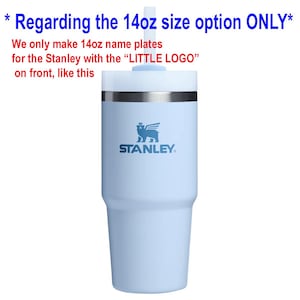 May include: A light blue 14oz Stanley tumbler with a white lid and straw. The text reads: Regarding the 14oz size option ONLY. We only make 14oz name plates for the Stanley with the LITTLE LOGO on front, like this. The cup features a winged bear logo.