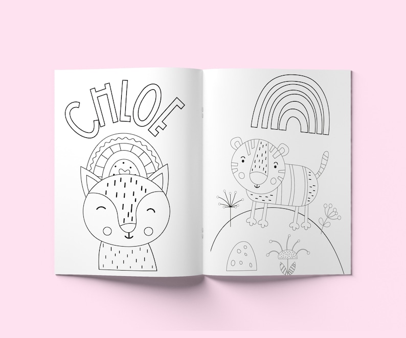 May include: A black and white colouring book with the name Chloe on the cover. The book features a cute fox with a rainbow above its head and a tiger with a rainbow in the background.