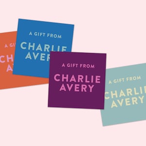 May include: Three gift tags with the text "A Gift From Charlie Avery" in different colors: blue, purple, and green.