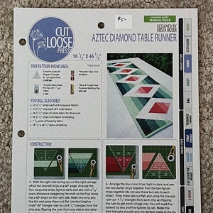 May include: A quilting pattern for an Aztec Diamond Table Runner, measuring 16 1/2 inches by 46 1/2 inches. The pattern includes instructions for cutting and sewing fabric strips to create a geometric design with turquoise, coral, white, and mint fabrics.