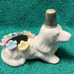Dog pin cushion with flowers and thimble holder