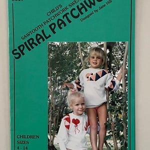 May include: A sewing pattern for a child's sweatshirt with a spiral patchwork design. The pattern is called "Spiral Patchwork" and is designed by Jane Hill. The pattern is for sizes 4-14 and is a perfect serger project.
