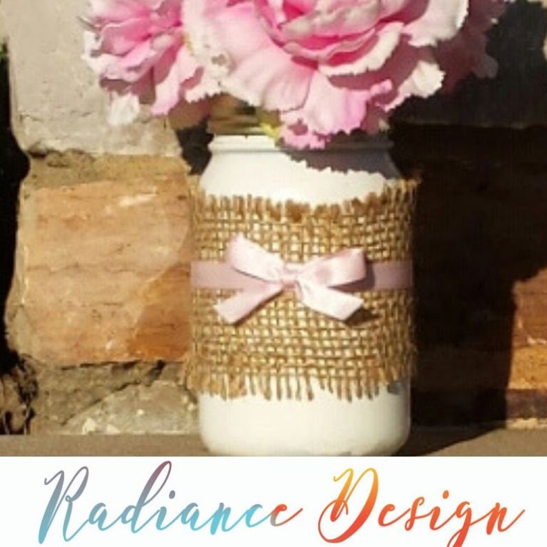 Dorothy:9 in White Mason Jar wrapped with Burlap and 3/8 pink satin ribbon inside mason jar are 3 pink carnations Flowers are included image 1