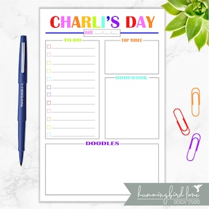 May include: A printable daily planner with the title "CHARLI'S DAY" in rainbow colors. The planner has sections for "TO-DO", "TOP THREE", "HOMEWORK", and "DOODLES".