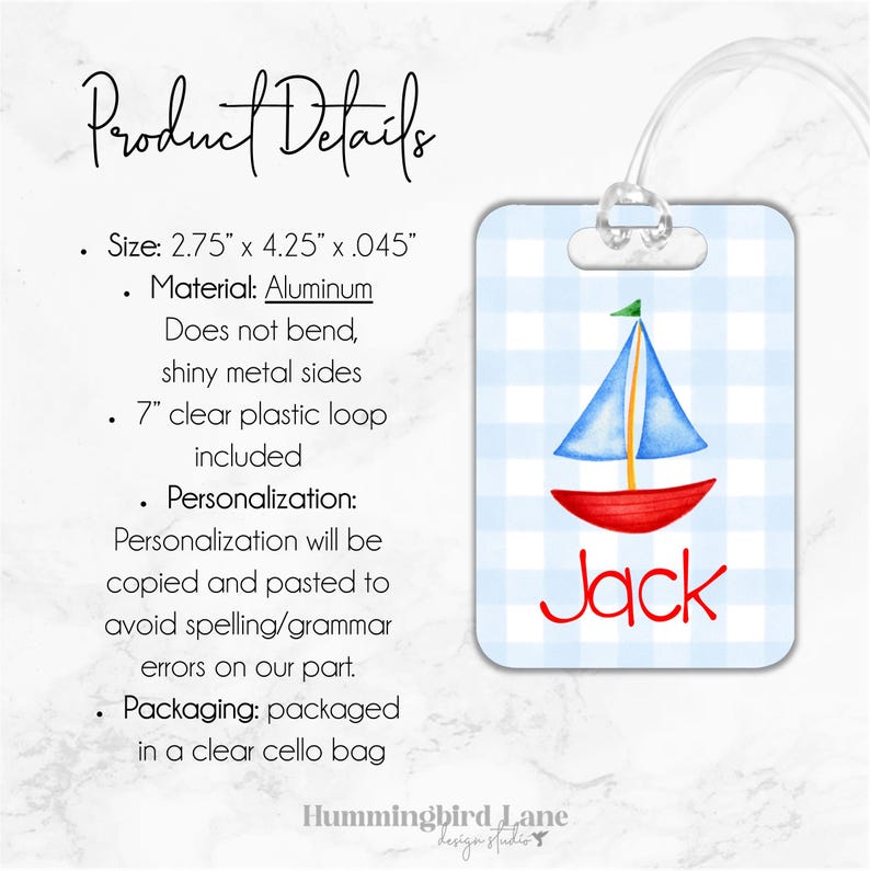 May include: A blue and red sailboat with a green sail on a white and blue gingham luggage tag. The tag is made of aluminum and has a clear plastic loop. The name "Jack" is printed in red on the tag.
