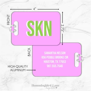 May include: Pink luggage tag with the letters "SKN" in green on the front. The back has the name Samantha Nelson, address, and phone number. The tag is 4 inches wide and 2.75 inches tall.
