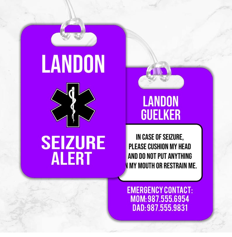 May include: Purple luggage tag with the text "LANDON" and "SEIZURE ALERT" in white. The tag also features a black and white medical symbol. The back of the tag has the text "LANDON GUELKER" in white, along with emergency contact information.