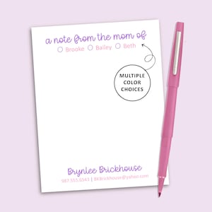 May include: A white notepad with purple text reading a note from the mom of, followed by the names Brooke, Bailey, and Beth with checkboxes. The bottom features the name Brynlee Brickhouse, a phone number, and email. A pink pen sits beside it.