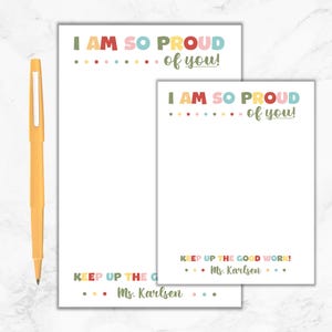 May include: Two printable notepads with a colorful "I am so proud of you!" message at the top. The notepads also have a "Keep up the good work!" message with the teacher's name, Ms. Karlsen, at the bottom.