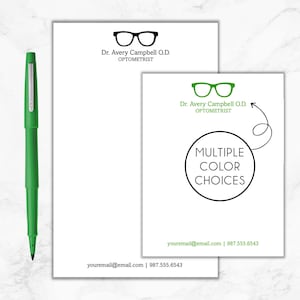 May include: A white business card with green eyeglasses and the text "Dr. Avery Campbell O.D. Optometrist" and a black circle with the text "Multiple Color Choices" and a green arrow pointing to the circle. The business card also includes the text "youremail@email.com | 987.555.6543".
