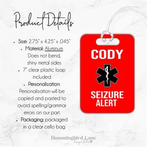 May include: Red luggage tag with a white star of life symbol and the text "CODY SEIZURE ALERT". The tag is made of aluminum and has a clear plastic loop.