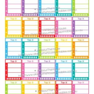 May include: Set of 25 printable stickers for an Erin Condren Life Planner. The stickers are 1.9 inches high and 1.5 inches wide. Each sticker has a colorful border and says "Top 3" with three blank lines for writing. The stickers are designed to be used in the white space underneath the "Morning/Day/Night" section of the planner.
