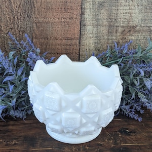 May include: White milk glass bowl with a textured, diamond-shaped pattern. The bowl has a scalloped rim and a wide base.
