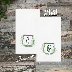 May include: Two white guest towels with green foliage and monogrammed initials. The first towel has the initial "C" and the second towel has the initials "NP". The text "Guest Towel your initials!" is printed on the second towel.