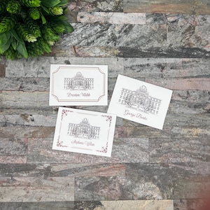 May include: Three white cards with black and white illustrations of a building with a dome. The cards have the names "Preston Webb", "George Burke", and "Stephanie Wilson" printed on them.