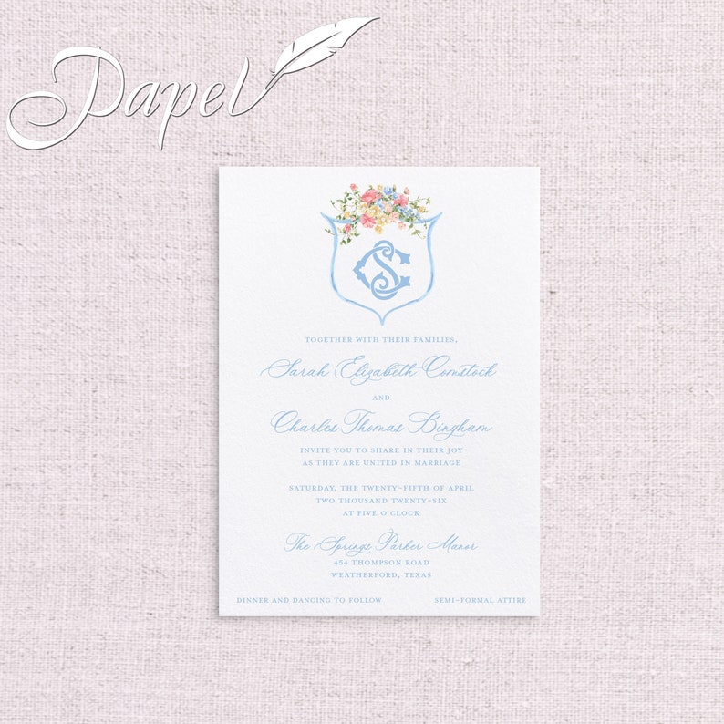 May include: Wedding invitation with a blue and white floral design. The invitation reads "Together with their families, Sarah Elizabeth Comstock and Charles Thomas Bingham invite you to share in their joy as they are united in marriage Saturday, the twenty-fifth of April two thousand twenty-six at five o'clock The Springs Parker Manor 454 Thompson Road Weatherford, Texas Dinner and dancing to follow Semi-formal attire"