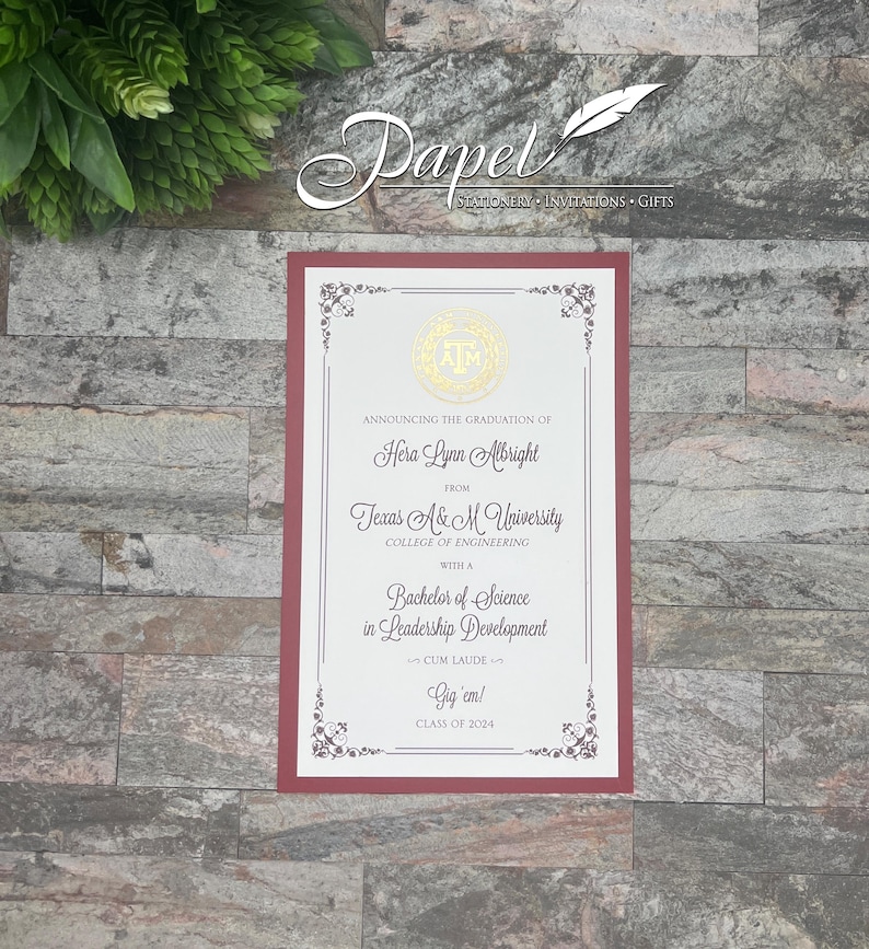 May include: A maroon and white graduation announcement card with a gold seal featuring the letters "A&M". The card announces the graduation of Hera Lynn Albright from Texas A&M University, College of Engineering, with a Bachelor of Science in Leadership Development, Cum Laude. The card also includes the text "Gig'em!" and "Class of 2024".